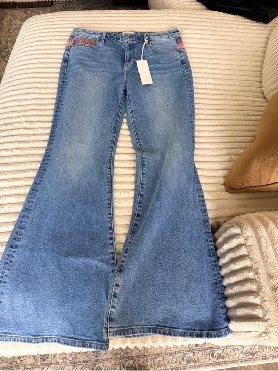 DRIFTWOOD Denim - Free People Driftwood Light Blue sunset Flare Jeans with Subtle Pocket Trim.